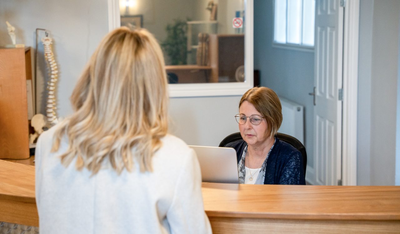 A patient waiting for chiropractic care in our Northampton clinic